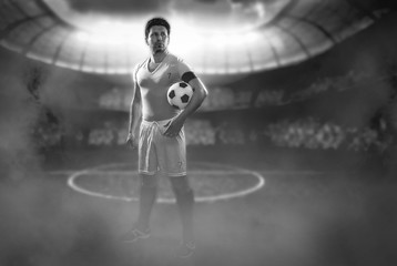 Football player with a ball on a football field.