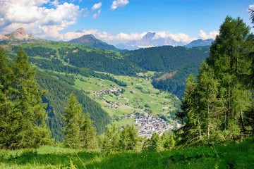 Fototapeta premium Beautiful summer mountain scenery Corvara di Badia town in the valley, Dolomites Italy