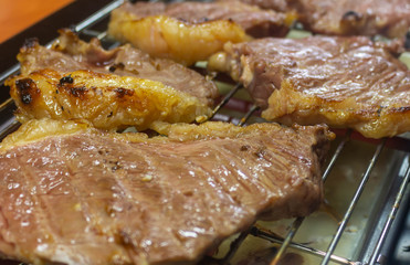 meat cooking on grill.