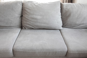 Grey comfortable sofa with pillows