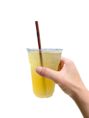 The hand of a person holding a glass of cold green tea on white background with work path.