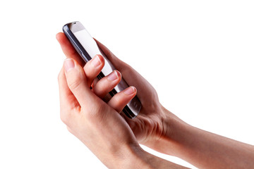 Holding a modern smartphone in both hands seen from the side, isolated on white, cut out, closeup. Two handed grip on a mobile phone, hand on hand, watching something on a phone screen concept