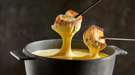 Delicious melted cheese fondue in winter