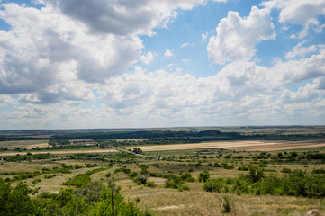Fototapeta na wymiar Clouds and nature of Donbass. Steppe nature.