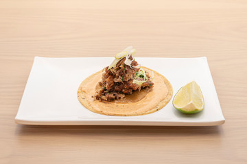 delicious lamb taco with a piece of lime