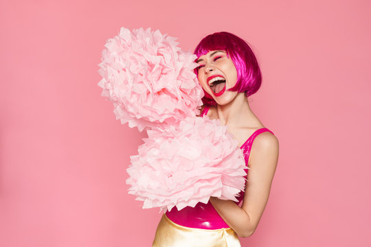 Image of excited nice woman screaming and dancing with pom-poms