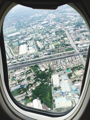 Fototapeta na wymiar Cityscape Seen Through Airplane Window