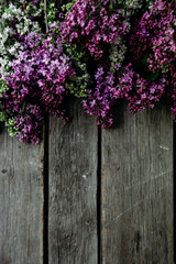 Lilac flowers on a wooden background. Free space