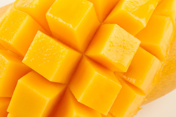 Closeup detail cut slice of ripe mango fruit