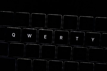 QWERTY. Night computer keyboard close up