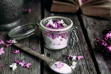 Sugar with lilac on a wooden table