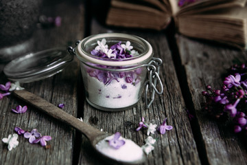 Sugar with lilac on a wooden table
