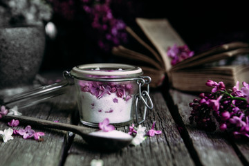 Obraz na płótnie Canvas Sugar with lilac on a wooden table