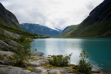 Naklejka na ściany i meble View of Nigardsbrevatnet lake surrounded by mountains - Jostedalsbreen national park, Norway