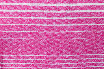 Natural pink and white striped woven fabric texture. Rough textile background