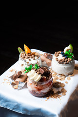 Fresh oatmeal and rice porridge with a beautiful serving and fruit. Bananas, berries, oranges and kiwi. Healthy and nutritious breakfast for children and adults. Different cereals