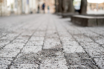 Obraz premium Cobblestone pavement is sprinkled with crushed granite, so that it is not slippery in the winter. Bottom view.