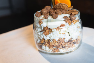 Fresh oatmeal and rice porridge with a beautiful serving and fruit. Bananas, berries, oranges and kiwi. Healthy and nutritious breakfast for children and adults. Different cereals