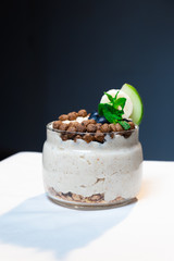 Fresh oatmeal and rice porridge with a beautiful serving and fruit. Bananas, berries, oranges and kiwi. Healthy and nutritious breakfast for children and adults. Different cereals