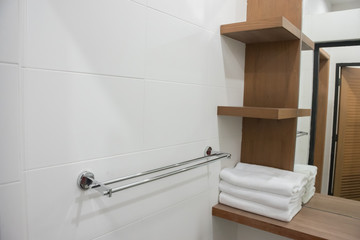 Fototapeta na wymiar Folding white towel in bathroom in the resort