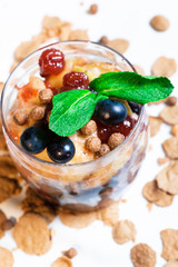 Fresh oatmeal and rice porridge with a beautiful serving and fruit. Bananas, berries, oranges and kiwi. Healthy and nutritious breakfast for children and adults. Different cereals