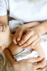 Close-up of female hands. A happy mom spends time with her little daughter. Daughter and mother together. Mother's love. Concept of maternal happiness