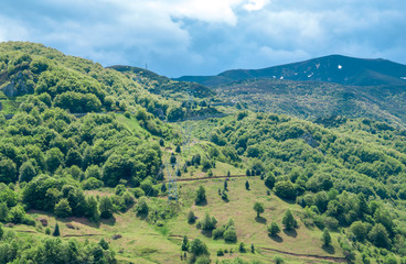 Mountain landscape with green and brown contrasts.