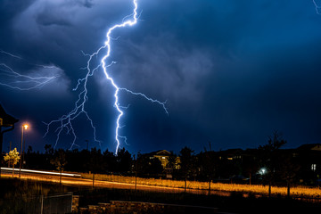 A bolt of lightning strikes the ground in a suburb of the city of Denver.