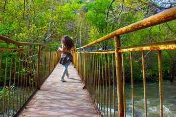 sexy girl on a bridge, young woman on the bridge, sexy woman walking on bridge, young woman walking on bridge