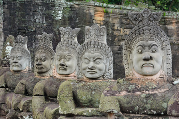Demon statues on the pathway to Bayon Temple, one of the famous Angkor Temples in Cambodia