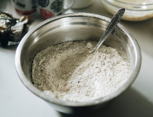 Flour inside of a metal bowl