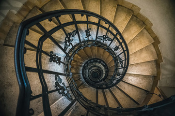 Antique stone spiral staircase in the tower of the bell tower of the Catholic Church	