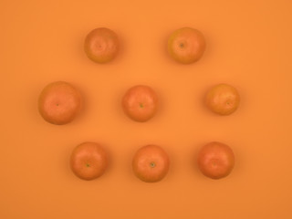 Ripe tangerine on an orange background. Citrus fruits.