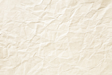 Old pale yellow crumpled paper background texture