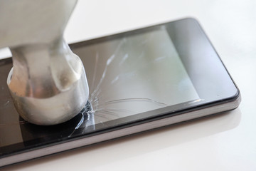 Smartphone display repair concept - abstract smash with a hammer.