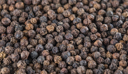 Black peppers peas background