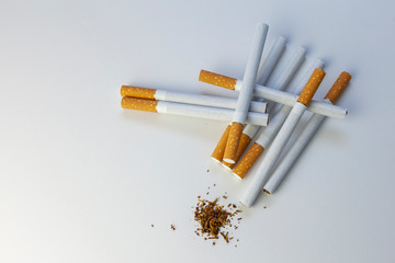 Tobacco. Cigarettes on a white background, top view