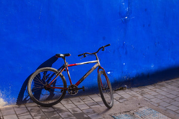 Blue wall and a bicycle, Morocco