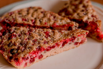Plate with delicious homemade cherry pie on white background