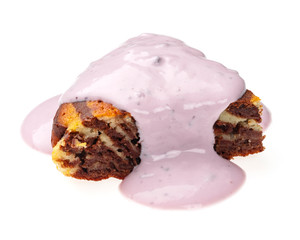 Slice of fresh yogurt drenched cupcake on a white background. Yummy chocolate cake