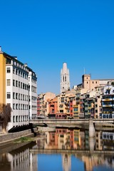 Fototapeta na wymiar Colorful houses of Girona in center of city en embankment of Onyar River
