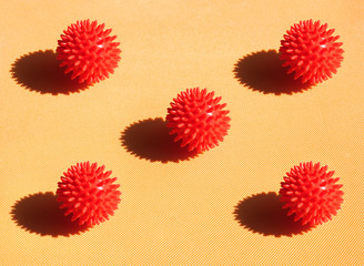 Fototapeta premium Red viruses covid19 fly on yellow background red bols with bright light and shadow