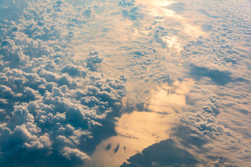 Sunrise above clouds and sea from airplane window. Natural background.