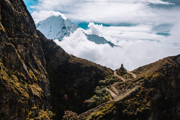 Road to the temple in cloudy mountains