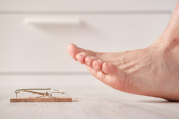 Bare feet run the risk of stepping on a mousetrap and getting injured at home on the floor.