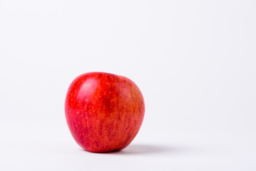 Portrait Of Red Apple Against White Background