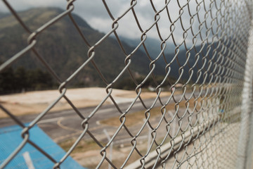 Close up fence. fencepost, mountains