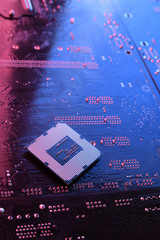 Computer cpu processor chip on circuit board ,motherboard background. Close-up. With red-blue...