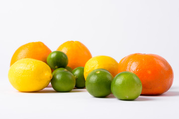 Portrait Of Assorted Citrus Fruits Against White Background