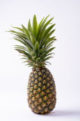 Portrait Of Ripe Pineapple Against White Background